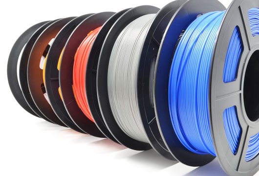 colour 3d pla printed parts reels of pla filament showing all the colours